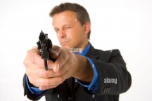 businessman-pointing-gun-B4YW9P.jpg